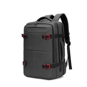 Business travel backpack in dark grey with USB port and red buckles on white background