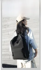 Detail showing high-quality black canvas material and durable zipper of the backpack