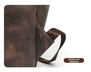 Macro shot of reinforced stitching on dark brown leather shoulder strap connection