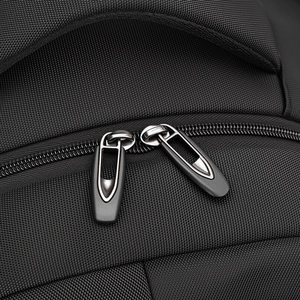 Macro shot of high-quality double zippers and durable nylon fabric on large backpack