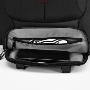 Detailed view of the front zipper pocket with phone compartment and cable organizer
