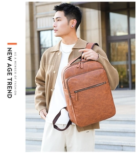 Close-up of brown PU leather business backpack with front zipper and side handle