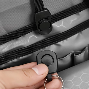 Detail of detachable key clip system with honeycomb textured lining in large backpack