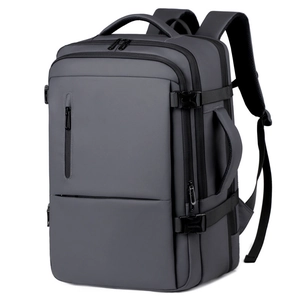 Sleek dark grey expandable business travel backpack with waterproof matte finish
