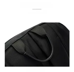 Close-up of the reinforced black leather handle and premium nylon fabric texture