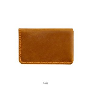 Detail of the back view showing neat stitching on a vintage brown leather card holder