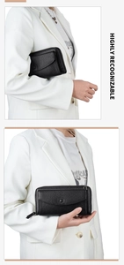 Détail du sac en cuir litchi noir avec fermeture éclair en métal et finitions premium