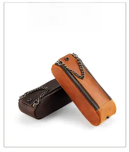 Detail of crazy horse leather pencil cases with vintage texture and double metal zippers