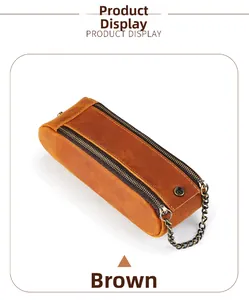 Close-up of brown crazy horse leather pencil case with dual zippers and copper chain