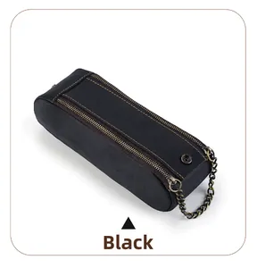 Macro detail of black crazy horse leather pencil case with yellow contrast stitching