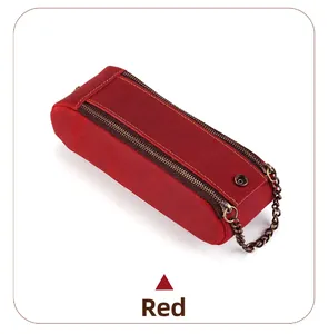 Macro detail of red crazy horse leather pencil case with bronze zipper and metal snap