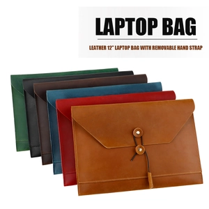 Detail of multi-color 12-inch leather laptop sleeves with vintage leather string closure