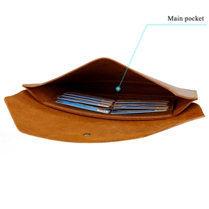 Detail of genuine leather laptop sleeve showing the main pocket and multiple card slots
