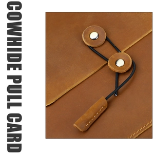 Detail of genuine brown cowhide folder with unique rivet and elastic cord closure