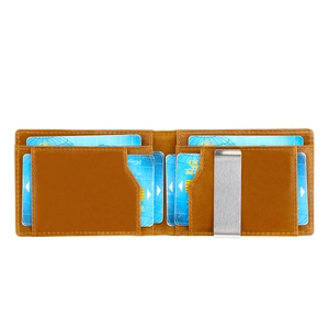 Detail of vintage brown leather wallet interior with card slots and a silver money clip