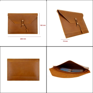 Brown leather laptop document bag with tie-wrap closure and internal card slots