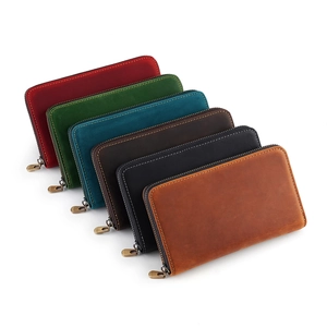Set of six genuine cowhide leather zip pencil cases in various retro colors and finishes