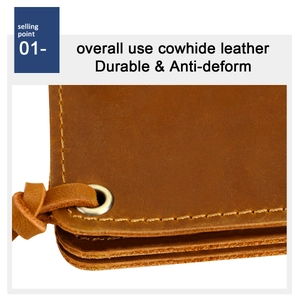 Close-up of vintage cowhide wallet featuring reinforced metal eyelets and durable stitching