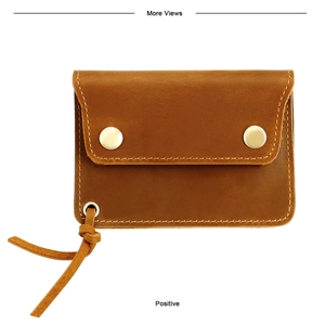 Front view of vintage brown leather card wallet with dual gold snap button closures