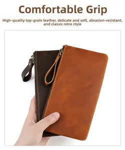 Detailed view of leather clutch wallets in brown and dark coffee with metal zippers