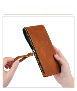 Detail of smooth metal zipper and premium crazy horse leather texture on pouch