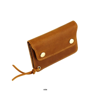 Detailed side view of vintage brown crazy horse leather wallet with double metal snaps