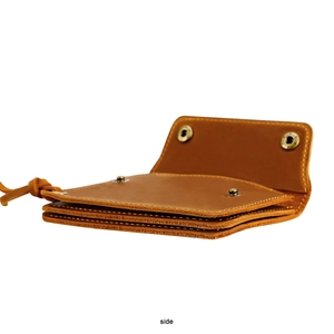 Side view of handmade crazy horse leather wallet showing layered card slots and brass snap