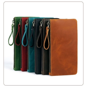 Flat lay of vintage crazy horse leather pouches in six different classic colors