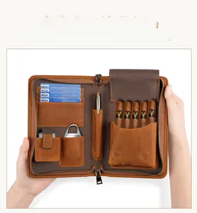 Brown leather travel cigar humidor case detail with slots for cards and cigar cutter