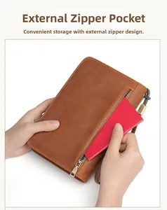 Close-up of the front zipper pocket and card slot on a brown leather cigar travel case