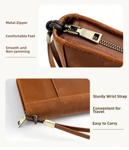 Detail of vintage brown leather cigar case with smooth zipper and sturdy wrist strap