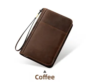 Macro shot of coffee brown genuine leather travel cigar case with wristlet and metal zipper