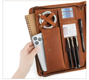 Brown vintage leather organizer detail with phone pocket and card slots