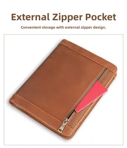 Close-up of retro brown leather iPad case showing the external zipper storage pocket