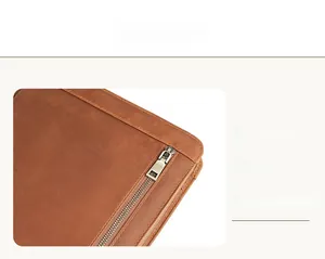 Detail view of premium brown leather tablet sleeve with external metal zipper pocket
