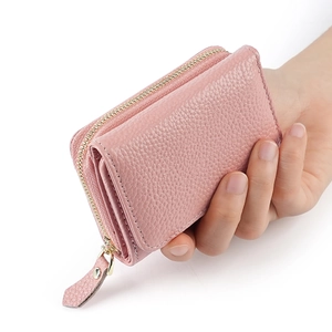 Pink lychee grain leather wallet with metal zipper closure and accordion card slots