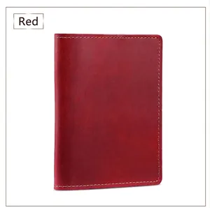 Detailed view of red crazy horse leather passport holder with fine stitching craft