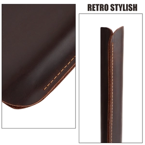 Detail of crazy horse leather texture and orange stitching on MacBook Pro 14.2 sleeve