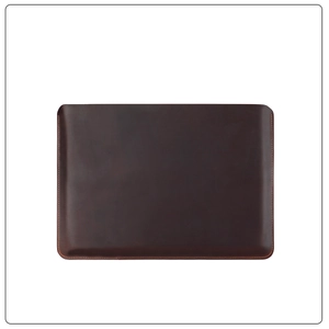 Detail of dark brown leather MacBook Pro 16 sleeve with precise contrast stitching
