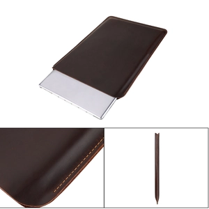 Detail of dark brown leather laptop sleeve with yellow stitching for MacBook Air