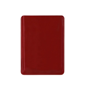 Detail of the high-quality dark red leather laptop sleeve with precise white stitching
