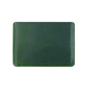 Detail of dark green leather desk mat with vintage yellow stitching and natural texture