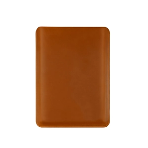 Detailed view of the caramel brown leather laptop sleeve with precision hand-stitched edges