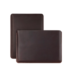 Premium dark brown leather laptop sleeve with contrast orange stitching for MacBook Air