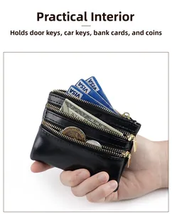 Detailed view of black oil wax leather wallet featuring three golden zippers and card slots