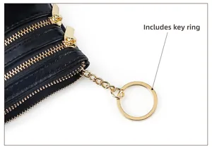 Detail of oil wax leather coin purse with golden zippers and built-in keychain