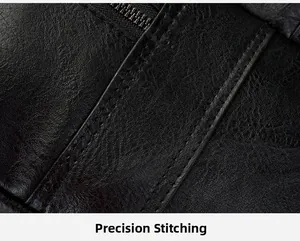 Detail view of precision stitching and premium lychee texture on black leather backpack