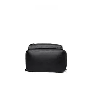 Detail view showing the bottom of a black PU leather laptop backpack with lychee texture