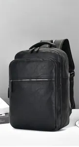 Close-up of black pebbled PU leather backpack with multiple zipper compartments