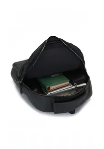 Detailed interior layout of black faux leather backpack showing 15.6 inch laptop compartment